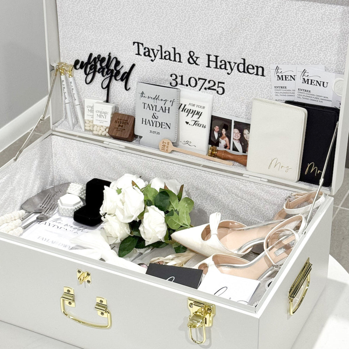 Decorative wedding-themed box with items and personalized text