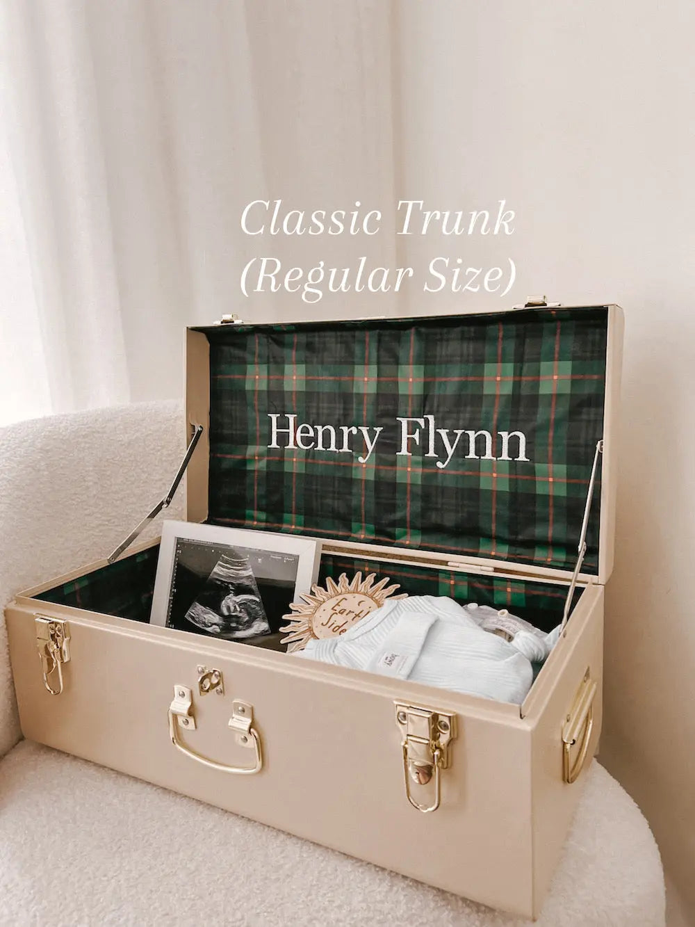 Beige trunk with plaid interior labeled &