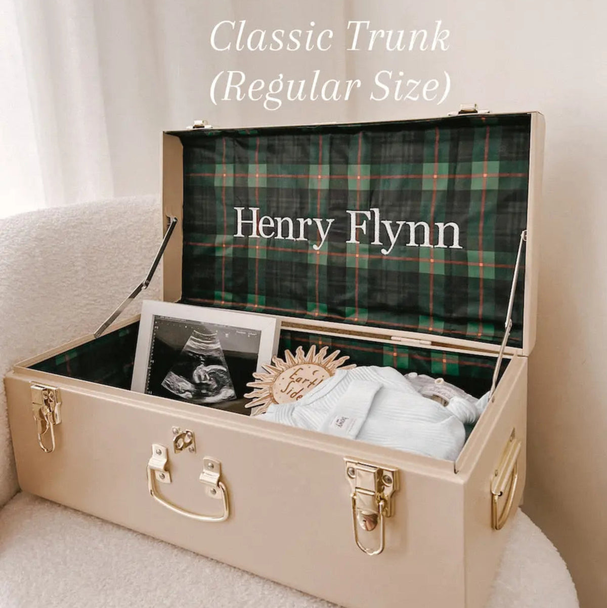 Beige trunk with plaid interior labeled &