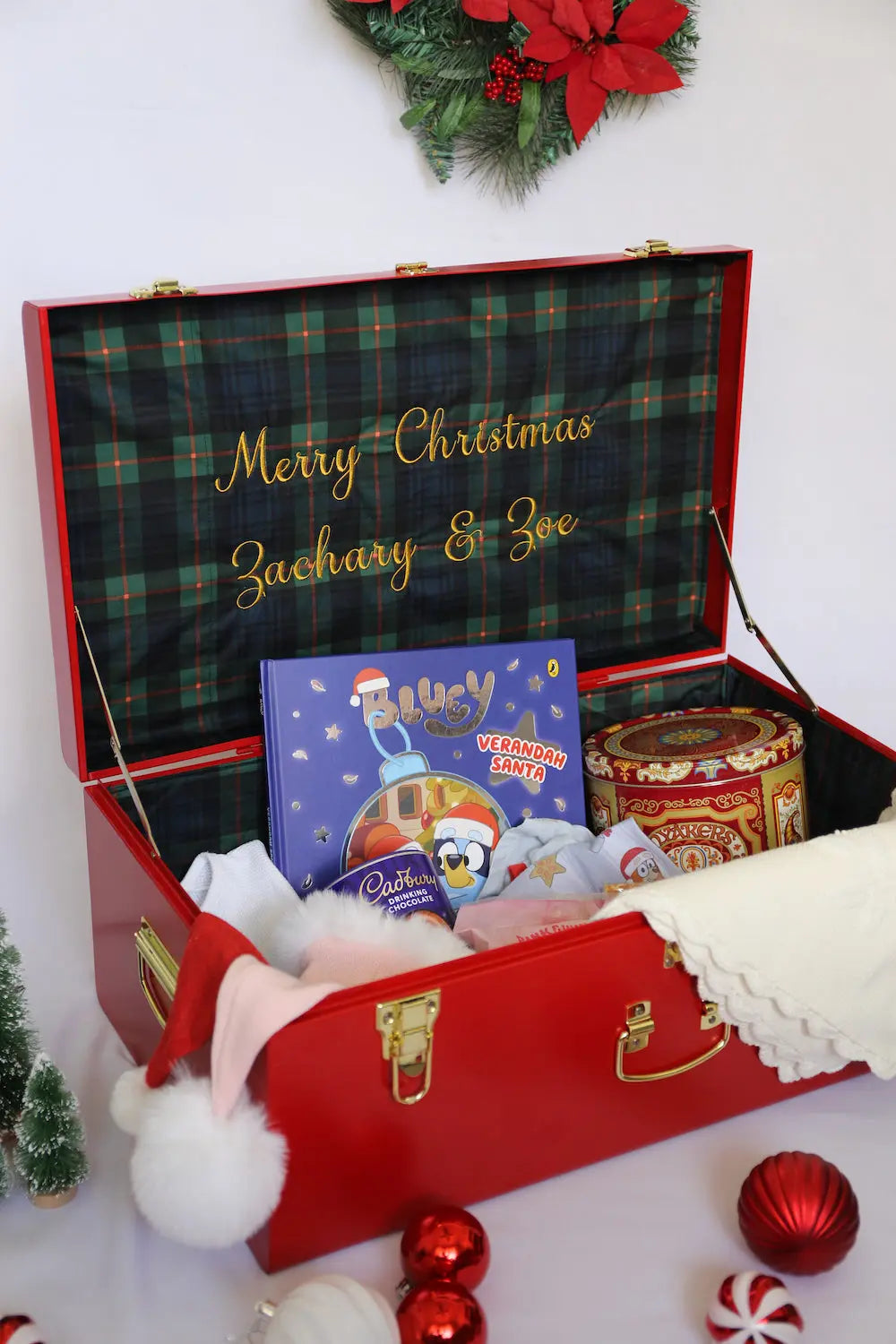 Decorative Christmas gift box with a book and candies, personalized with &