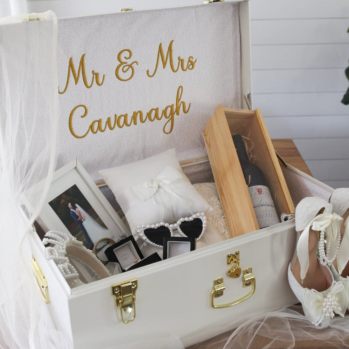 White suitcase with &