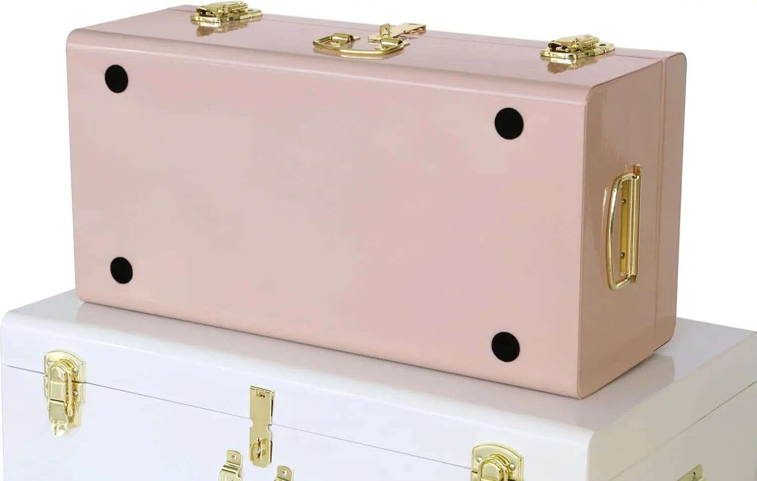 Two metal storage trunks, one pink and one white, with metal handles and latches.