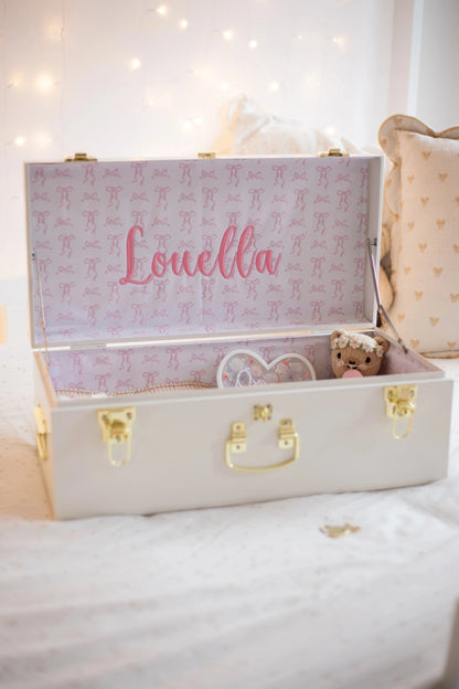 White suitcase with &